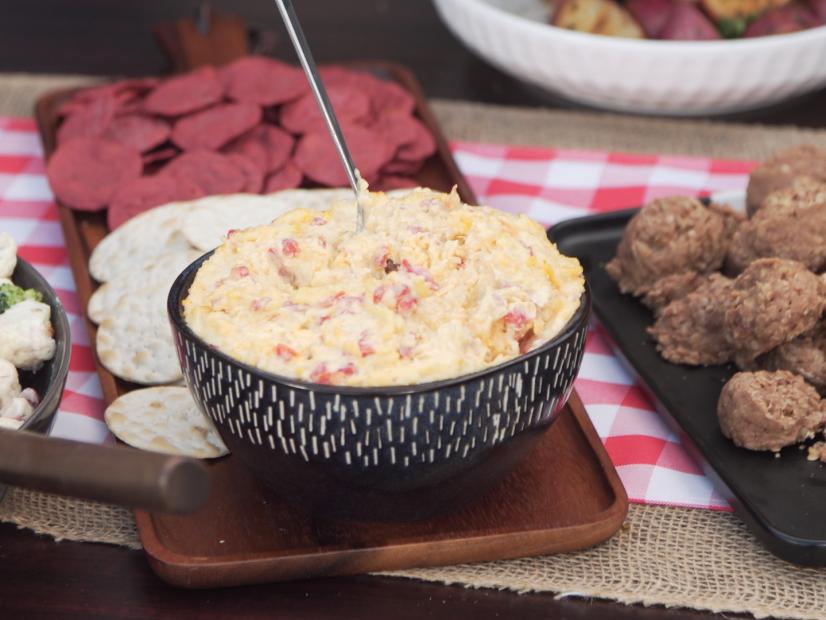 Delicious Smoked Gouda Pimiento Cheese is a tasty, versatile dish for a grillout! As seen on Food NetworkÃ­s MartinaÃ­s Table.
