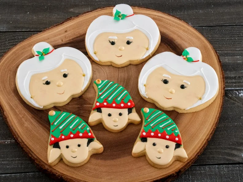 Contestant Mary Valentino's dish Elf and Mrs. Claus, Vanilla Sugar Cookie with Royal Icing, during the first round, The Decorating Challenge, "Christmas Nightmare", as seen on Christmas Cookie Challenge, Season 2.