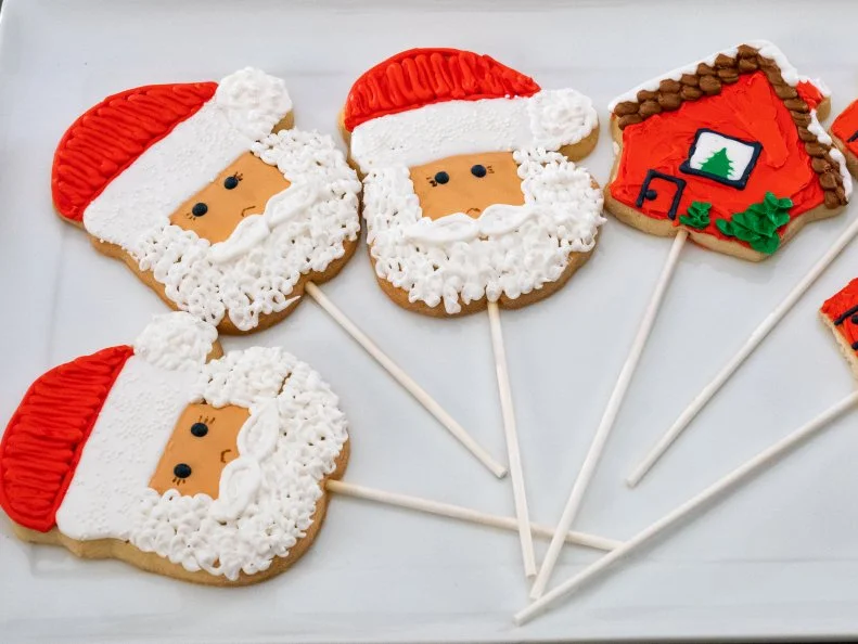 Contestant Terri Fry's dish Santa and House, Vanilla Sugar Cookie with Royal Icing, during the first round, The Decorating Challenge, "Christmas Cookies On A Stick", as seen on Christmas Cookie Challenge, Season 2.