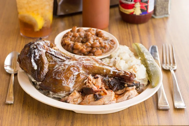 Pork may be synonymous with barbecue throughout the Southeast, but in North Alabama, chicken is what's for barbecue dinner. (All right, fine — pulled pork is too.) While the state has an array of regional specialties, it's best known for its white sauce. That tangy mix of mayo, vinegar and spice was invented by Big Bob Gibson in 1925 as a flavor accentuator for locally sourced birds that are slowly cooked until tender and juicy in hickory-fired brick pits. That pairing is so good that it has since spread to neighboring restaurants in the northern part of the Cotton State.