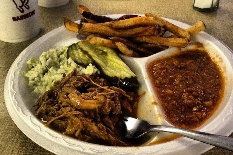 A three-in-one, the barbecue sauce that's popular around Macon, in Middle Georgia, combines all of the main ingredients found throughout the United States: mustard, vinegar and a bit of ketchup. The acidic sauce is used to marinate the pulled and chopped pork once it's pulled out of the wood coal-fired masonry pits. Since the 1930s that sauce and method of cooking have been the backbone of Fincher's Bar-B-Q, the historic place where many believe the style was created. (Its out-of-this-world 'cue was taken into outer space on a NASA space mission!) There and at other local barbecue spots, the piquantly sauced meat is served alongside smoked pork- and tomato-scented Brunswick stew.