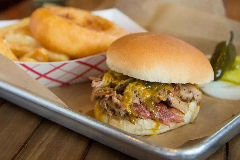 When those who don't fully grasp the intricacies of Carolina 'cue think of South Carolina, mustardy Carolina Gold sauce is the only thing that comes to mind. It's that iconic. Created in the 1930s, most likely by the Bessinger family, the sauce includes a mix of mustard, vinegar, brown sugar, pepper and spices. It's used to flavor whole hogs and pork shoulder, smoked over hardwood, at restaurants spread throughout the middle of the Palmetto State. At places like Melvin's Barbecue in Charleston, platters come with a traditional side of "hash and rice": pork simmered with potatoes and onions in a gravy-like stew and accompanied by rice.