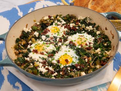 Baked eggs with kale, green chiles and feta, as seen on The Kitchen, Season 19.
