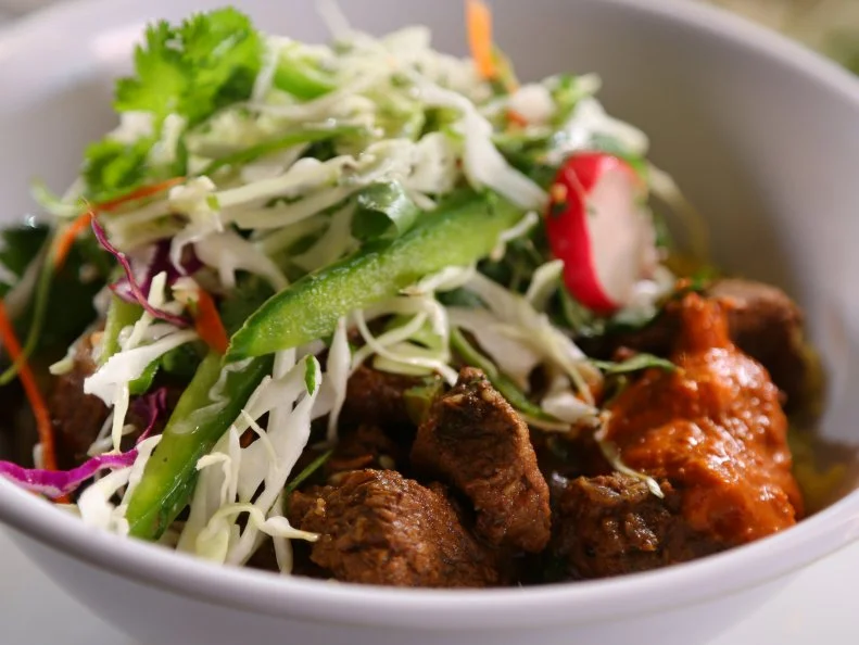 A bowl of Curry Beef from Biju's Little Curry Shop in Denver, CO, as seen on Food Network's Diners, Drive-Ins and Dives, Season 23.