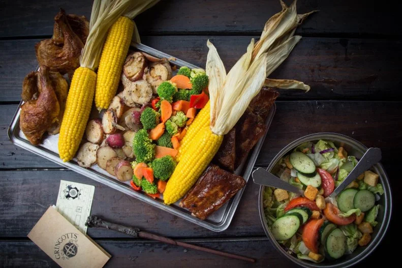 If you're at Universal Orlando to immerse yourselves in Hogsmeade, then you must lunch as the wizards do. In this part of The Wizarding World of Harry Potter, Three Broomsticks is your meal ticket. Enter a (faux) snow-topped tavern, which inside has a warm yet eerie feel with a decidedly rustic British decor. The wizard wannabes will care more about sampling Pumpkin Juice, Gillywater and Butterbeer than their chicken legs and fish 'n' chips. That leaves you free to fill up on chicken and ribs with corn on the cob and roasted potatoes, or beef pasties, a smoked turkey leg or a rotisserie smoked chicken platter. Finish with a chocolate trifle. G'day.