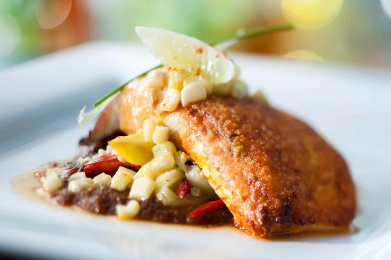 Avocado margaritas, housemade corn tortillas and a broad range of Mexican foods — including several "Healthy Choices" options — are reason enough to choose La Hacienda de San Angel for your Epcot dinner. The shrimp tacos come with chipotle-lime aioli, and the pan-seared snapper has a tequila-butter cascabel pepper reduction with roasted tomatillos. Here's the second reason: Time it right and you can see the nightly Illuminations of the fireworks and laser show through the restaurant's windows and from its patio seating area. What's more, the music is piped in so you'll get the full Reflections of Earth experience. Your wee Disney darlings can go the south-of-the-border route with a cheese quesadilla or eat all-American mac 'n' cheese. But choosing the chocolate brownie over the dulce de leche ice cream? ¡Ay yi yi! Just say no.