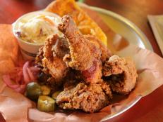 <p>Rob Larman and his wife are serving up old school barbeque in the heart of California wine country at Cochon Volant. Chef Larman puts his unique spin on fried chicken by soaking it in a sweet-and-spicy brine laced with granny smith apples and pasilla chile paste. &ldquo;This is a chef&rsquo;s fried chicken,&rdquo; said guy between bites. Their other claim to fame is the towering WTF Burger. A seared beef patty is topped with 14-hour smoked brisket, smoked pork shoulder, house-cured maple bacon, a fried chipotle pork cake, melted cheddar cheese and house-made barbeque sauce.</p>