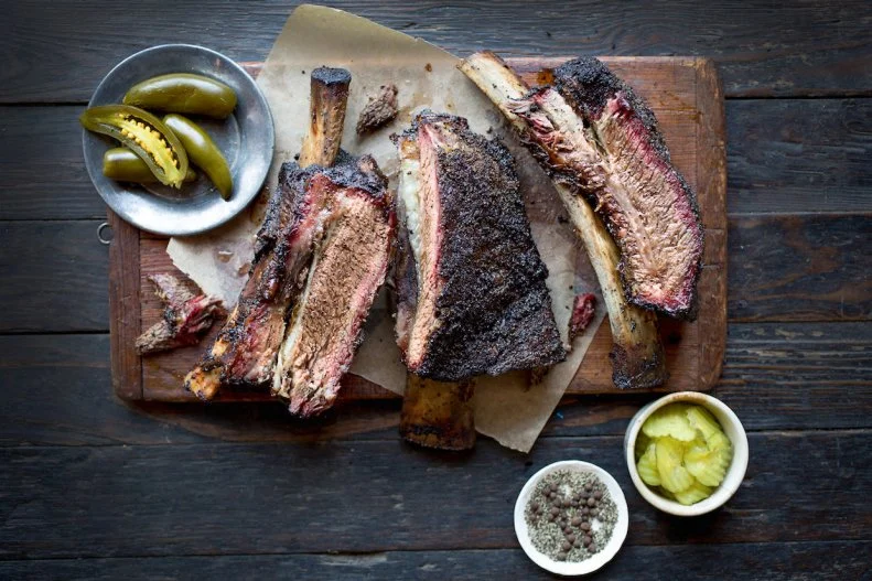 You've seen it before: gleaming slabs of brisket, sliced on a cutting board, weighed by the pound and served on butcher paper. The barbecue spawned by Central Texas' meat market tradition is one of the most-iconic styles in the entire U.S. There's a reason it's so well known: It requires an immense amount of skill to be done right. Those hunks of beef are simply seasoned with black pepper, salt and sometimes cayenne, and indirectly smoked with post oak until they achieve a juicy center and a nice dark bark. Sauce is served on the table at most places, but chances are it's not necessary for the flavorful meat. While Franklin Barbecue in Austin is the most-famous barbecue restaurant in the area, there are plenty of other spots, like Louie Mueller in Taylor, that also do a darn fine job of slow-smoking their meat into tender submission.