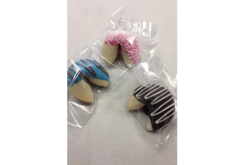 By now most folks probably know that fortune cookies are not a "thing" in China, despite their popularity at Chinese restaurants across the U.S. It was California immigrants â   possibly even Japanese settlers â   who popularized the dessert, peddling them from family-run bakeries throughout San Francisco and Los Angeles. The Golden State remains a stronghold, thanks to companies like Chocolate Fortunes, SoCal's largest distributor of dipped and decorated treats since 1987. While the cookies are generally prized less for their flavor than for the paper prophecies they hold, this company ensures that the cookies are tasty by dunking them in dark chocolate, white chocolate, mint chocolate and butterscotch chocolate. They also play with proportions, offering a 7-inch Giant size and a 4-inch Baby Giant size as well as the traditional size.