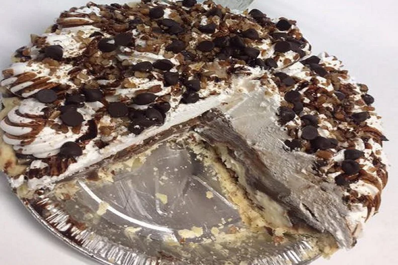 Not to worry ... no marsupials were harmed in the making of this pie! The jury is still out on how it got its colorful moniker, although general consensus is that the pie "plays possum." Instead of pretending to be dead, it creates the illusion that it's less delicious than it is, hiding layers of custard and pudding under a shroud of whipped cream. That said, the secret is very much out at Russellville's Old South â   the last remaining outpost of a circa-1947 chain â   whose owners have always known better than to take the cream-cheesy, pecan-crusted confection off their Southern comfort menu.