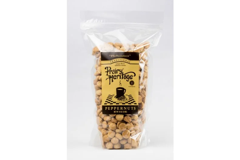 Also known as peppernuts (the translation of their German name), these bite-sized spice cookies are a popular holiday treat throughout Germany, Denmark and the Netherlands. You'll find them in Kansas, too, and you don't need to wait till Christmas to get your hands on one (or 10 â ¦ they're tiny!). Prairie Harvest, located on the edge of Flint Hills, stocks them year-round. It's fitting, considering the area is where many German Mennonites settled in the 19th century, bringing their peppernut-making traditions with them. They used to store the dough in crocks in fruit cellars so the spices permeated it completely, then roll it into long ropes and slice them into cookies, or cut small circles from flattened dough using thimbles. Nowadays, Prairie Harvest offers three versions: traditional, wheat-free or, interestingly, without anise (we guess the licorice-y spice has proved to be a love-it-or-hate-it ingredient).