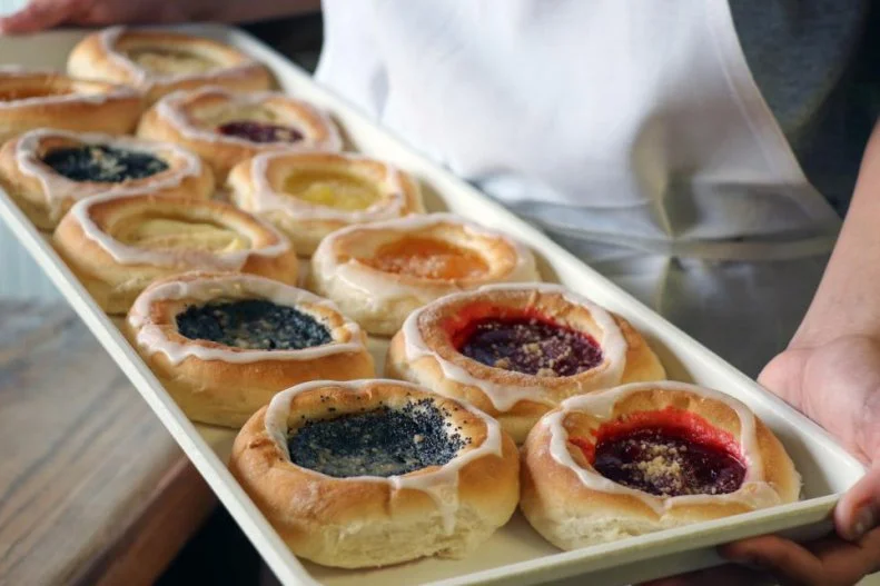 An influx of Czechoslovakian immigrants in the 1800s led to South Dakota's abiding love of kolaches, which are as round as the wheels from which they take their name. Made from coils of soft and sweet yeast dough, wrapped around fillings like cheese and fruit, they're omnipresent during Tabor Czech Days, an annual festival celebrating South Dakota's Central European founders. Thankfully, Tyndall Bakery â   in operation since the 1900s â   provides a means of enjoying kolaches the whole year round. And with a wide range of flavors, including apple, cherry, apricot, lemon, poppyseed, strawberry-cream cheese and prune, visitors can switch up their kolache order every day of the week.