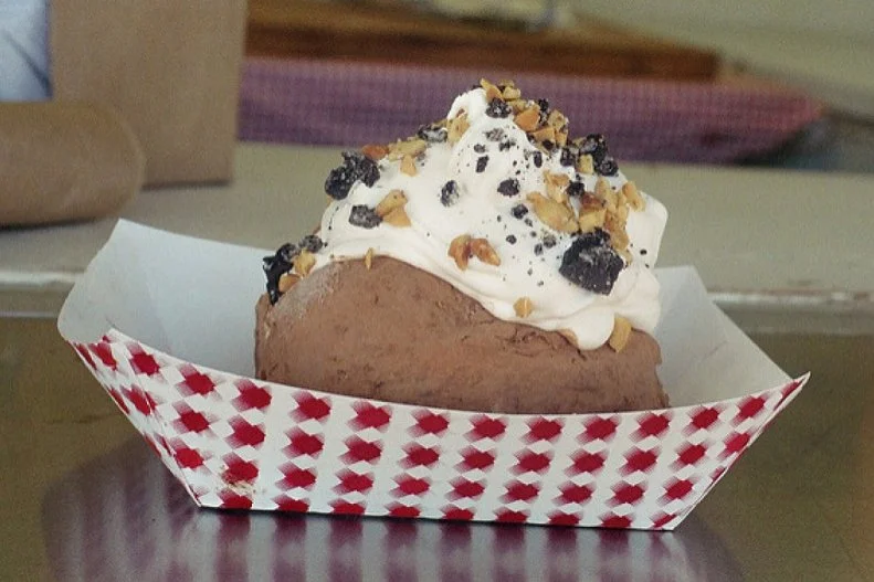 What greater expression of Idaho's allegiance to potatoes can there be than the fact that the state has managed to bring them into the dessert realm? Not content to limit his tubers to savory preparations, Chef Lou Aaron also crafts spuds entirely out of ice cream! Rolled in cocoa powder and topped with whipped cream "sour cream," this Idaho no-tato looks impressively like the real thing. No wonder the quirky, circa 1957 drive-in â   among Boise's very first â   has been drawing in crowds for over 60 years.