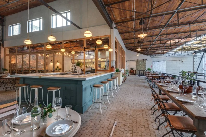 The Arts District in downtown Los Angeles has become one of the hottest neighborhoods in the city, a destination for art aficionados and food lovers, dotted with galleries, restaurants and cool coffee shops. It's a great place to walk around with your dog. Take a load off and fill up on the coastal-California-meets-Southern fare at Manuela, which is adjacent to Hauser & Wirth's open-air art gallery courtyard. The restaurant has a covered, dog-friendly patio with secluded tables and an expansive outdoor bar, where guests sip classic cocktails blended with housemade bitters and tonics while snacking on dishes like Shigoku oysters with hot sauce mignonette and cream biscuits with honey butter and country ham. Good dogs can sniff out the on-site herb garden and chicken coop at the end of the meal.