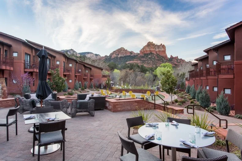 Sedona is known for its jaw-dropping views of crisp blue skies punctuated by vibrant red rock formations. Nestled on the banks of Oak Creek, the restaurant of the Amara Resort & Spa sits just below those bright crimson spires. Many restaurants in town boast beautiful panoramas from their outdoor patios, but SaltRock's vista is one of the nicest in town. Dogs are welcome to hang out and enjoy the scenery with their pet parents, who can sample the fresh Southwestern-inspired fare and agave-focused drinks. The menu offers flavorful dishes like pasilla-maple syrup and bacon-onion marmalade-scented deviled eggs, carnitas tacos with pineapple-habanero salsa and braised osso bucco. Water bowls and dog treats are available for four-legged friends upon request.