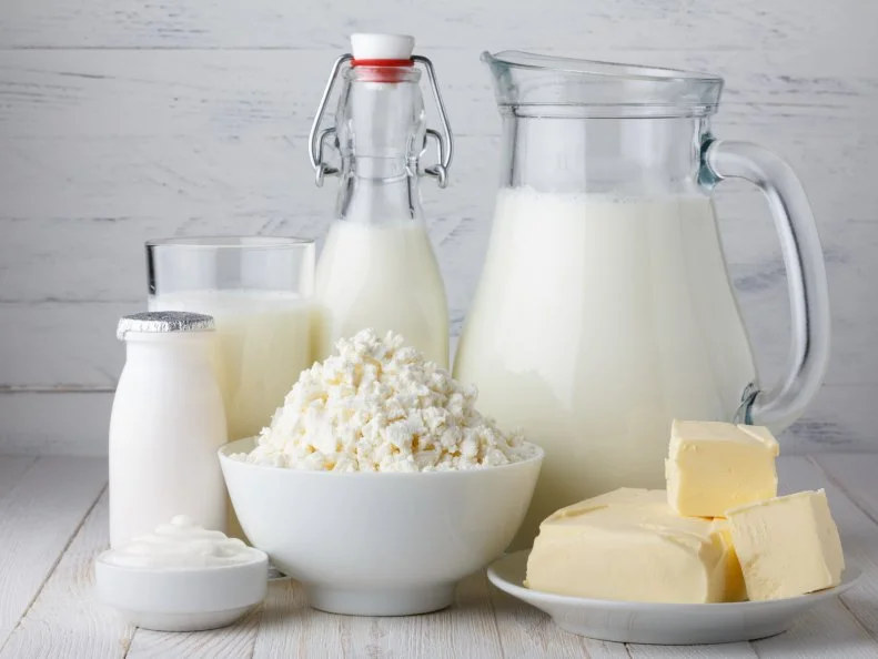 Dairy products on white wooden table