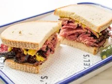 Feast your eyes (and then your belly) on the mounds of whitefish salad, cold cuts and smoked lox that tantalize from behind a wall of deli glass at this old-school-meets-hipster spot on the Greenpoint side of Brooklynâ  s McCarren Park. The hot pastrami on rye with mustard is as classic as it comes. But unlike earlier generations of New York City Jewish delis, which view tampering with the simple pastrami-rye bread-mustard formula as the ultimate taboo (weâ  re looking at you, Katzâ  s), this relative newcomer encourages customers to add some melted Swiss and make it a Reuben. Better yet, stop by for breakfast and try the juicy pink pastrami on rye bread, a challah roll or a bagel, with griddled eggs and cheese.
