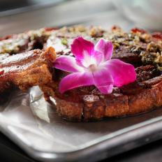 The Kan Kan Pork Chop as Served at Luna Rosa Puerto Rican Grill y Tapas in San Antonio, Texas, as seen on Diners, Drive-Ins and Dives, Season 30.