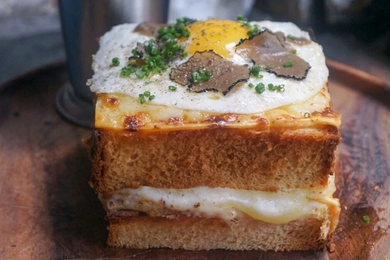 There are many great reasons to visit the bustling Chelsea Market, and the grilled cheese at Le Song is one of them. French-trained chef Olivier Palazzo puts a croque madame spin on a grilled cheese: It's made with soft and buttery brioche baked as a pullman loaf, plus cheddar cheese and a truffle-infused bechamel, and is topped with a sunny-side-up egg, black truffle shavings and a sprinkling of chives.