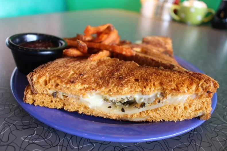 This welcoming restaurant with locations in New Hampshire, Vermont and Massachusetts focuses on making its New England customers happy by using local ingredients to create fun and delicious dishes. The grilled cheese is no exception, made with American and cheddar cheeses, a brushing of an olive-and-garlic spread, and cheddar-cayenne bread baked fresh in-house daily. It's served with a strawberry habanero sauce on the side for dipping, dunking or spreading.
