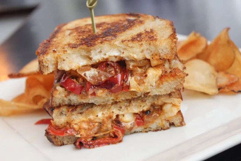 Seafood is the star at this coastal neighborhood restaurant, so why shouldn't the grilled cheese have lobster in it? The chef decided to make a lobster scampi version of grilled cheese, taking tomatoes straight from the restaurant's 1-acre garden,combining them with garlic, Parmesan and mozzarella, and chunks of fresh lobster, and serving it all on ciabatta bread.