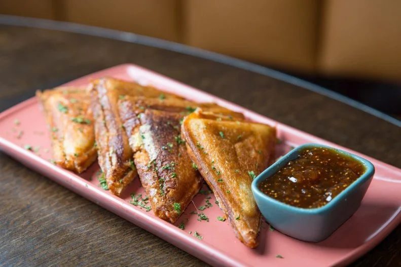 This Long Island bar and grill takes grilled cheese to a whole new level by swapping out the bread for pancake dough. Yep, they wrap Swiss cheese and ham (or mozzarella and prosciutto if you prefer) in pancake dough for an enveloped sandwich. It's served with a sweet fig jam on the side for dipping.
