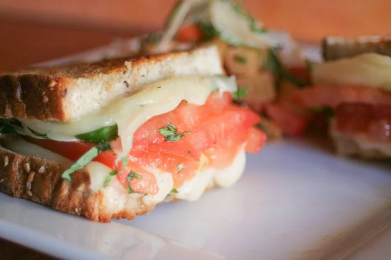 This quaint little cafe north of Detroit, in walkable Royal Oak, has been welcoming patrons for well over a decade. Its unassuming grilled cheese sandwich has garnered much national acclaim and remains a favorite among regulars. The sandwich is made with three cheeses — Havarti, fontina and fresh mozzarella — melted on bread from famous Zingerman's Bakehouse in Ann Arbor. Local basil and tomatoes from the farmers market are added when in season. The secret ingredient is Wild Detroit honey; used sparingly, it adds a hint of sweetness to the sandwich.