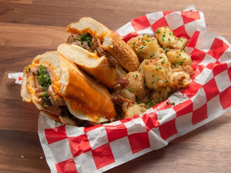 Host Anne Burrell's game day pork with broccoli rabe sandwich, as seen on Worst Cooks In America, Season 15.