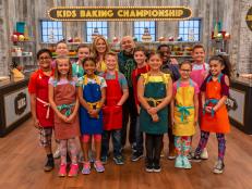 Hosts Valerie Bertinelli and Duff Goldman pose with the contestants for a photo, as seen on Kids Baking Championship, Season 6.