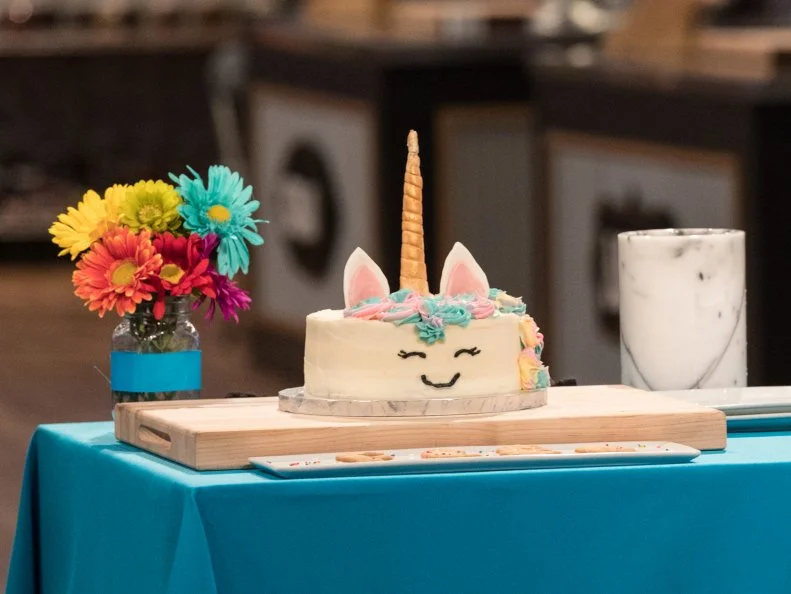 Contestant Linsey Lam presents her dish from the main heat challenge to the judges, as seen on Food Network's Kids Baking Championship Season 4
