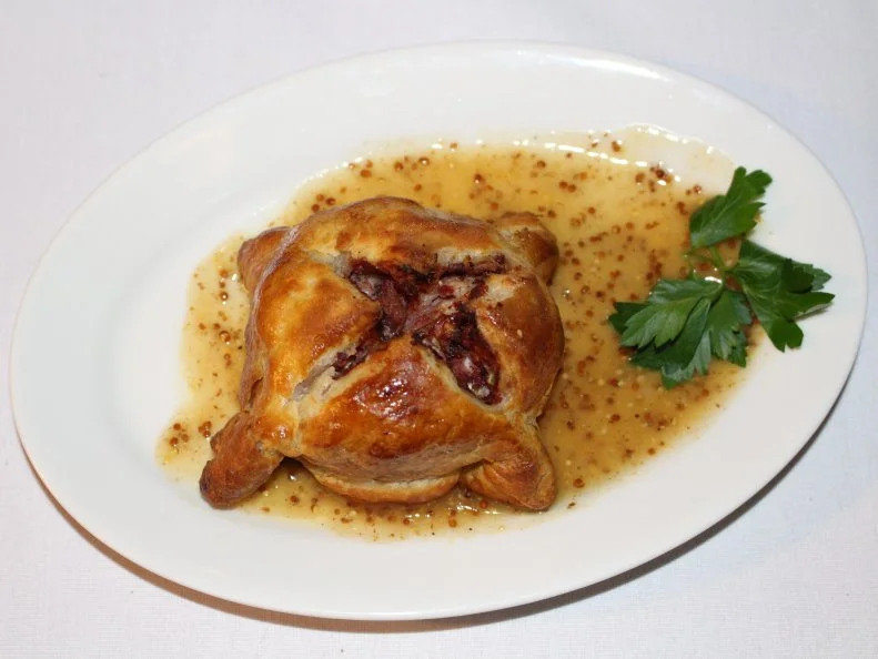 This family-owned pub offers a menu of Irish-accented comfort food favorites, including several popular pasty options.  The Irish influence shines through most brightly in the best-selling Corned Beef Pasty. Corned beef and shredded cabbage are brought together in this satisfying riff served with stone-ground mustard gravy. A cup of creamy clam chowder pairs perfectly with this pick. Other pasty options include a chicken-and-mushroom combo topped with tarragon sauce, as well as a seafood version brimming with a bounty of local crab and shrimp.