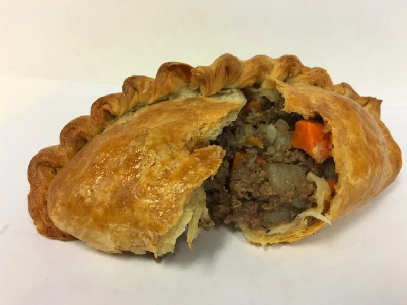 Owner Mike Burgess believes that any dish can be turned into a pasty, as evidenced by his shop’s innovative menu. Unexpected riffs like Chicken Cordon Bleu and Moroccan Lamb go well beyond the basic pasty recipe. Burgess also showcases his culinary creativity with ever-changing chef’s specials like a Reuben-inspired pasty stuffed with corned beef, sauerkraut and Thousand Island dressing. The best-selling Traditional Beef, however, stays true to the dish’s origins. Burgess makes the filling from grass-fed beef, russet potatoes, Vidalia onions, carrots and black pepper, then seals the mixture inside his buttery homemade pastry featuring six flaky layers. 
