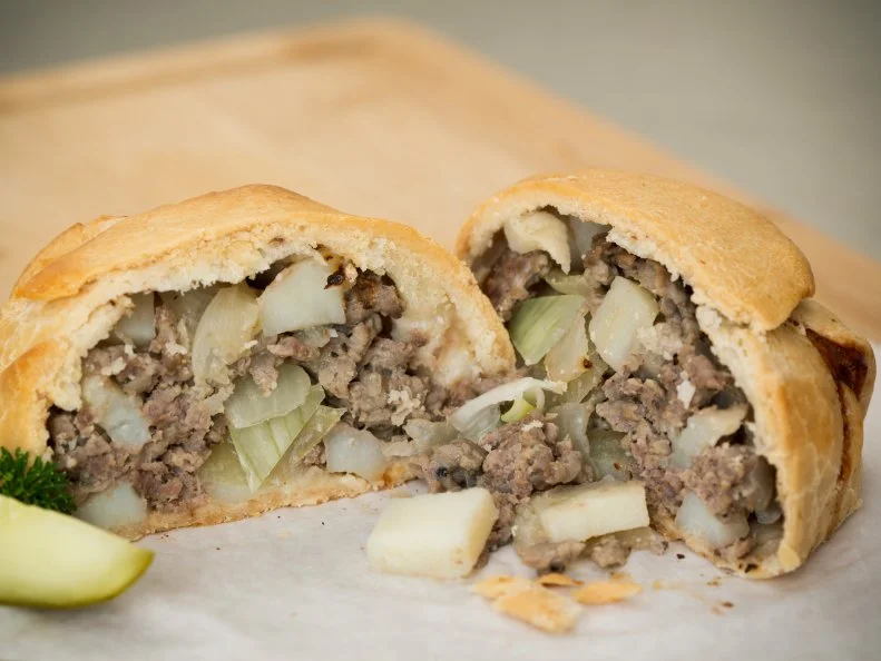 So irresistible are the fresh-from-the-oven pasties sold at this takeout-only shop that customers can often be seen sneaking in a quick bite before driving off with their order. These hand pies stand out for their light, flaky crust made with beef shortening. The edges are pressed shut instead of crimped, giving the finished pie a distinctive look that differs from the traditional pasty. Customers can choose from three options for the fillings: freshly ground beef paired with potatoes and onions; sweet Italian sausage combined with potatoes, peppers and onions; or chicken mixed with potatoes, peas and carrots.