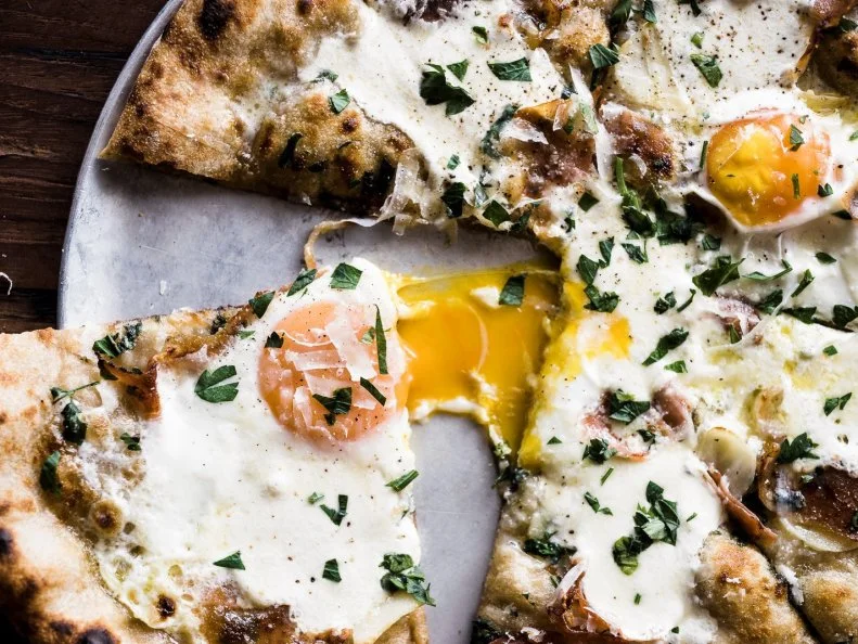 There are lots of wood-fired ovens grilling pizzas in Asheville, but All Souls Pizza hovers at the top of the list for its commitment to locally sourced ingredients, even in the dough. Using fresh-milled flour made from regionally grown grains, the uniquely flavored and  textured dough is naturally fermented with native yeast. Featuring country ham from Goodnight Brothers and fresh local pullet eggs from Dry Ridge Farm, their flavorful Country Ham and Egg Pizza is a fan favorite, though most it's hard to lose with any seasonal pie. Individualists can choose from their list of additional toppings (including fermented chiles and sardines).