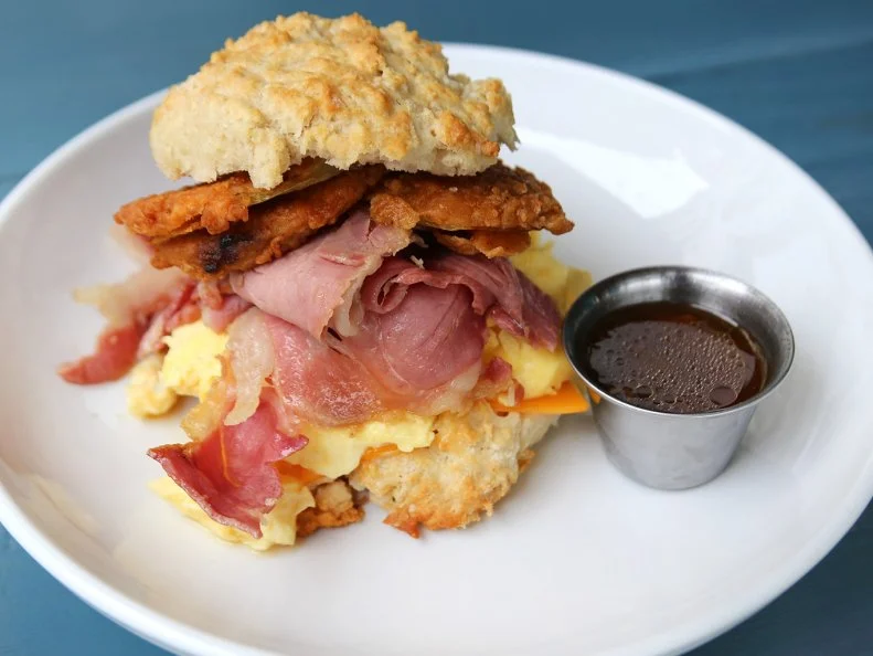 Biscuits were always an assumption in the South, but they've recently become a talking point, particularly at places like Biscuit Head, with two Asheville locations. Lines at both attest to the popularity of their oversized biscuits, seven gravies (try a fully flight!) and other offerings. The country ham biscuit is a great breakfast, with ham, fried green tomato, cheesy scrambled eggs and red-eye gravy dipping sauce (think French dip). For a lunch option, the brisket biscuit overflows with local beef, pickled onion, house-smoked Looking Glass Creamery chèvre, a poached egg and buffalo hollandaise sauce, with sweet caramelized bananas balancing the spice.  