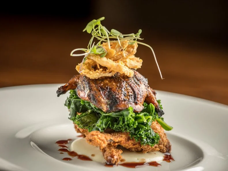 The Asheville dining scene skews casual, with plenty of fleece-clad diners. But in bustling Biltmore Village, Red Stag Grill in the art-filled Grand Bohemian Hotel Asheville brings a bit of formality without stuffiness. The rustic hunting-lodge-meets-modern-mountain-cabin atmosphere sets the scene for Executive Chef Scott Ostrander’s European comfort food. Dishes include Carolina quail prepared two ways (grilled and fried), served with local kale, crispy shallots and creamy celery root purée. After dinner, sip a signature martini or cocktail over live music in the lounge.