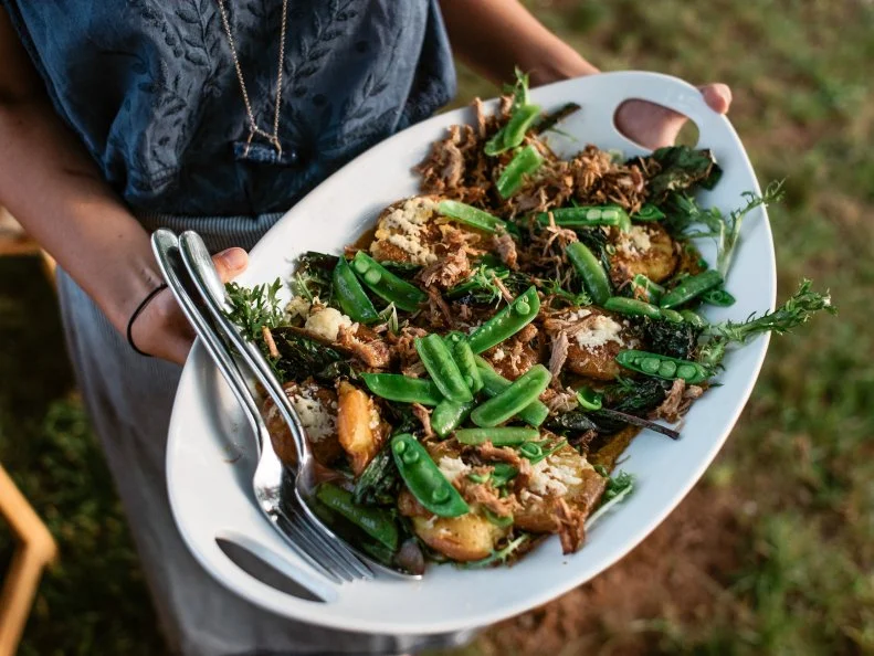 Sunday supper is a tradition in the South and something that is near and dear to Chef John Fleer's heart. Every Sunday at 6:30 p.m. sharp, the communal tables in Rhubarb's Family Room fill with passing plates and shared stories. The three-course faily-style meal reflects the bounty of Asheville's weekend tailgate markets. A family favorite is the Gaining Ground New Potato Frico -- smashed new potatoes topped with shaved Cane Creek Creamery Stronghold cheese, grilled dandelion greens, crispy pork collar, sugar snaps and an earthy charred carrot romesco. A local guest farmer hosts each week's tables, making Sunday supper  a farm- and farmer-to-table experience.