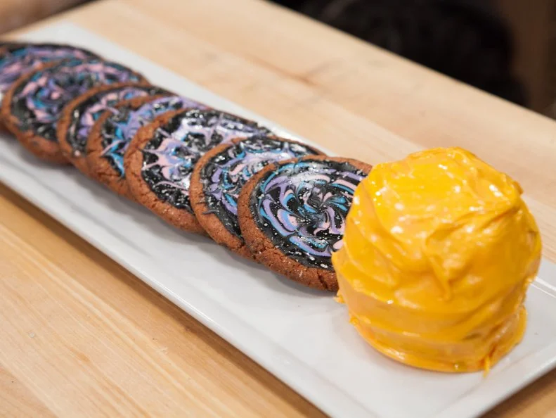 Kid Baker Linsey Lam's freeze dried intergalactic dessert themed strawberry sugar cookie with royal icing, and rice cereal sun, as seen on Kids Baking Championship, Season 4.