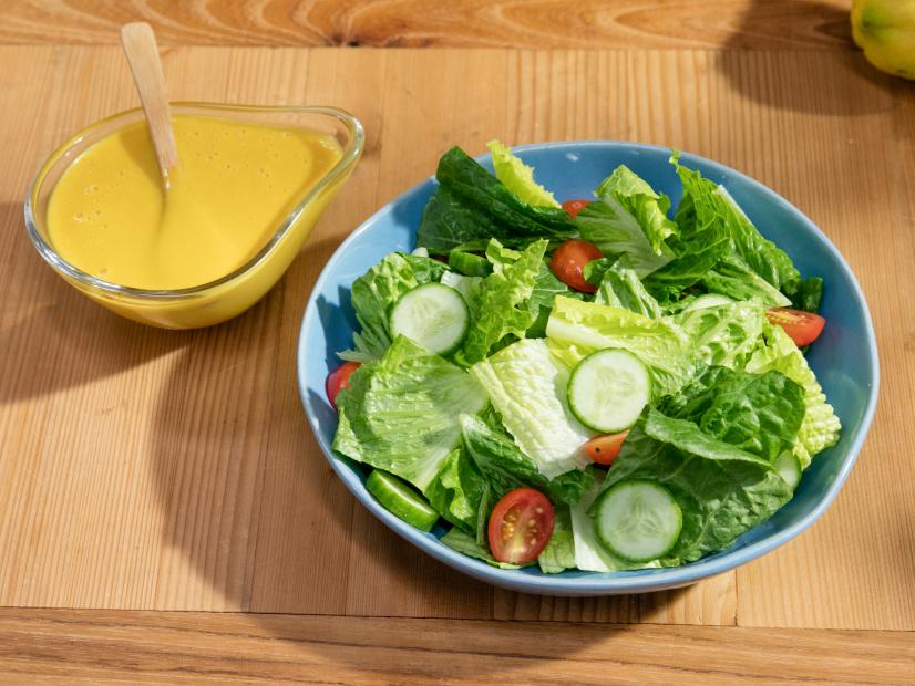 Co-host Katie Lee's dish Creamy Honey Mustard dressing with a salad, as seen on The Kitchen, Season 16.