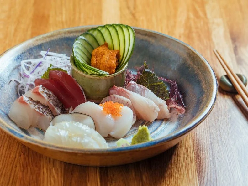 In Japan, an izakaya is fundamentally a low-key pub, geared toward drinking, that just happens to have an assortment of tasty snacks to accompany said drinking. Minato serves all of the benchmarks, from okonomiyaki, a griddled cabbage pancake, to kara-age, the traditional style of fried chicken made popular in Japan. The small, unassuming bar is true to form, and while regulars can’t get enough of the sashimi plates or kimchi fried rice, most will tell you that the first time you visit, the preferred way to fly is the Omakase. This chef’s choice menu, the low price of which borders on the obscene, serves as the perfect Izakaya 101. 