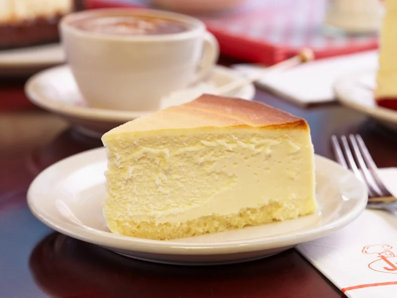 Restaurants all around the world purport to serve New York cheesecake, but when it comes to procuring a slice in the Big Apple, head over the bridge to Brooklyn, where the iconic Junior's flagship serves fluffy cakes in a 1950's-era diner at the commuter-thronged crossroads of Brooklyn's Flatbush and DeKalb. And while the neighborhood has steadily changed around it, to make way for glassy condos and office towers, an imposingly weighty slab of cheesecake, made in small batches from the same, straightforward recipe of premium cream cheese, vanilla, eggs and heavy cream, can be had for $7.75.