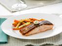 Beauty of crispy skin salmon with herb butter medallion and gazed carrot and zucchini, as seen on Food Network’s Trisha’s Southern Kitchen Season 11