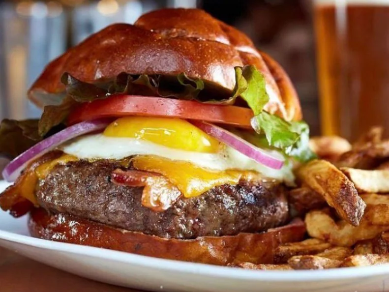 This is the place where punk rock meets a mean burger meets craft beer. On Guilty Pleasures, Chicago chef Graham Elliot loves the Mastodon burger: a burger packed with bacon, cheddar and frizzled onions and slathered with BBQ sauce. “It totally lives up to its name,” he says.