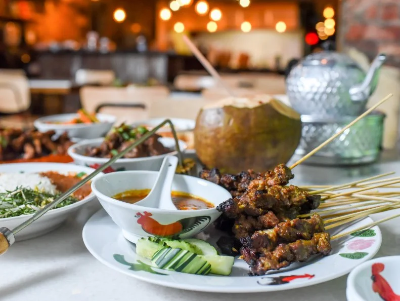 A native of Kuala Lumpur, Angelina Branca hit pause on a successful international finance career to open this BYOB saté shop with her American-born husband, John, crafting her proactive response to the fading traditional food culture of her home country. Here you’ll find all manner of traditional skewers done in authentic marinades and caramelized over special coconut charcoal Branca imports from Southeast Asia, but it’s not just food on sticks. Staple dishes like beef rendang, along with recurring specials like chile crab or variations on the noodle soup laksa, keep diners coming back for a transportative taste of Malaysia’s diverse and dynamic cuisines.