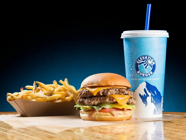 Hamburgers fuel the fast-food market, and though Elevation Burger is fast and affordable, the chain stands out from the crowd with its organic beef from grass-fed, free-range cattle. Hans and April Hess opened the first Elevation Burger in Falls Church, Virginia, in 2005, and it quickly gained a loyal following for thoughtful touches like fries cooked in olive oil, cheeseburgers made with six-month-aged cheddar, and veggie burgers made using organic grains and vegetables. The newest addition, Crispy Chicken, coats organic poultry in gluten-free breading. There are now nearly 50 locations of this eco-friendly burger joint, which are crafted with sustainable materials and outfitted with energy-saving lighting. Find one in Virginia, Washington, D.C., Maryland, Pennsylvania, New York, Maine, Michigan, Florida, Texas, and even the Middle East.