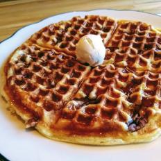 After embarking on a culinary tour of the States, Portland natives Moses and Alec Sabina returned home with one goal in mind: to share a taste of the South in the North. That’s why Hot Suppa’s buttermilk waffle is speckled with pecans and not New England blueberries, though its crusty pockets are drenched in Maine-tapped maple syrup. At dinner, a plain waffle is also available, paired with sweet tea-brined chicken and whipped butter.