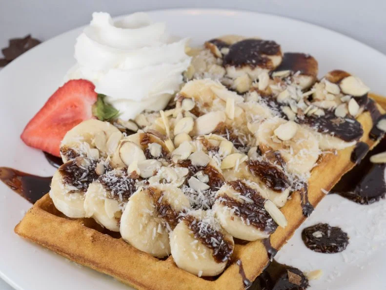 Inspiration comes from near and far at this Bozeman crepe and waffle shop, where menu items nod at their origin city or state. Both the Wisconsin and Vermont options highlight cheese, for example, while bananas and caramel sauce â   from local confectioner Bequet â   play a starring role in the Rio and Cusco. The Maui â   a buttery waffle loaded with sliced bananas, toasted almonds, shredded coconut and dark chocolate sauce â   is an especially good tropical escape in the winter months, when hefty snowfalls are the norm in Bozeman.