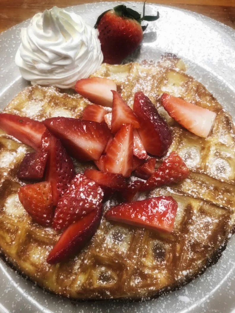 Chef Mitchiel deBoer believes â  that every great breakfast place needs a solid waffle,â   a motto we wholeheartedly endorse. At his bakery, which has roots in the original Holland, the buttermilk waffle mix is made from scratch every morning, with batter pressed to order, so each guest gets one thatâ  s hot and tender. The toughest part is choosing what toppings to add: caramelized bananas, fresh strawberries or deBoerâ  s cinnamon-flecked Dutch apples.