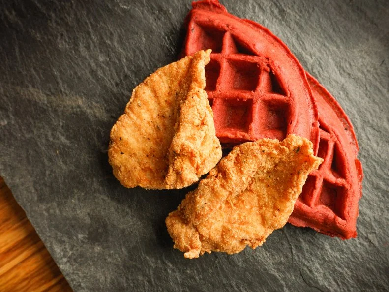 Every component of LuLu’s chicken and waffle platter is thoughtfully crafted by Chef Mike McClure. Not fully satisfied with the standalone red velvet waffle recipe the restaurant had been using, McClure tweaked it to stand up to the addition of fried poultry. His quest for fried chicken and waffle perfection paid off, yielding a complementary balance of a savory, crackly-skinned breast with a subtly sweet waffle that pulls equal weight in the dynamic pairing.