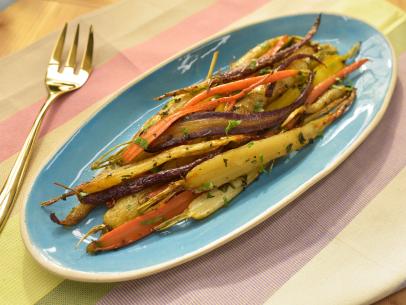 Katie Lee makes Roasted Carrots with Honey and Mint, as seen on Food Network's The Kitchen  ,Season 16.